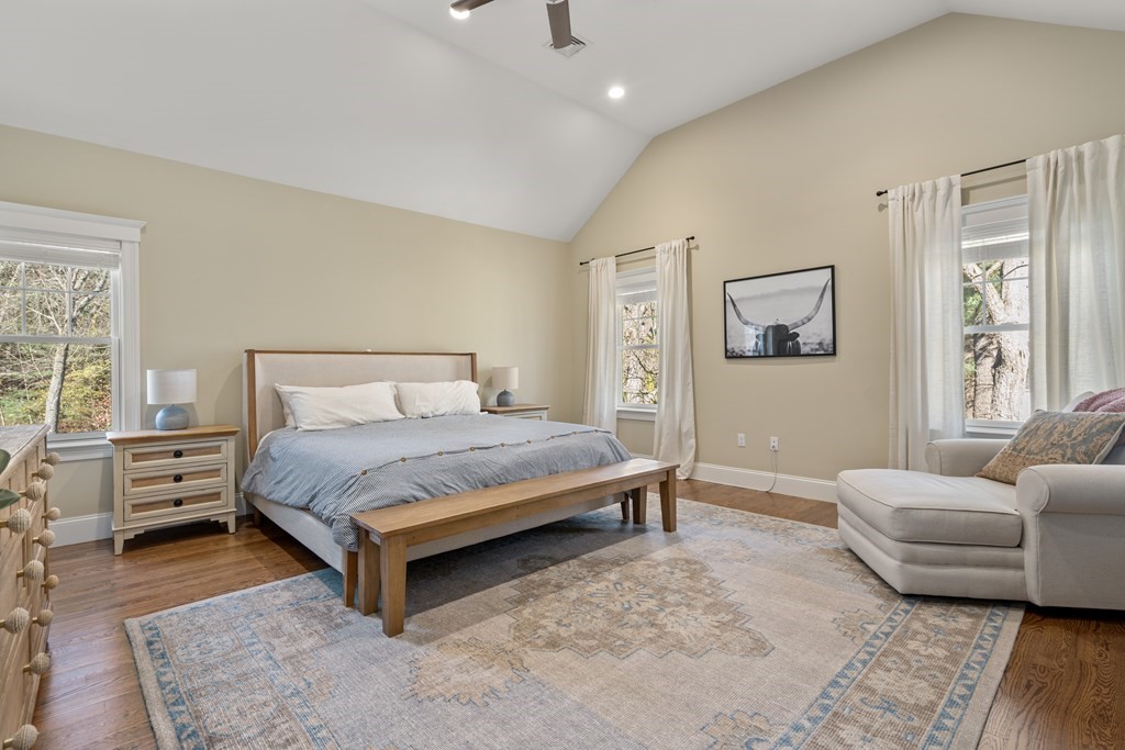 33 Centre Street Dover, MA 02030 - Photo 13 of 32 a bedroom with a bed and wooden floor