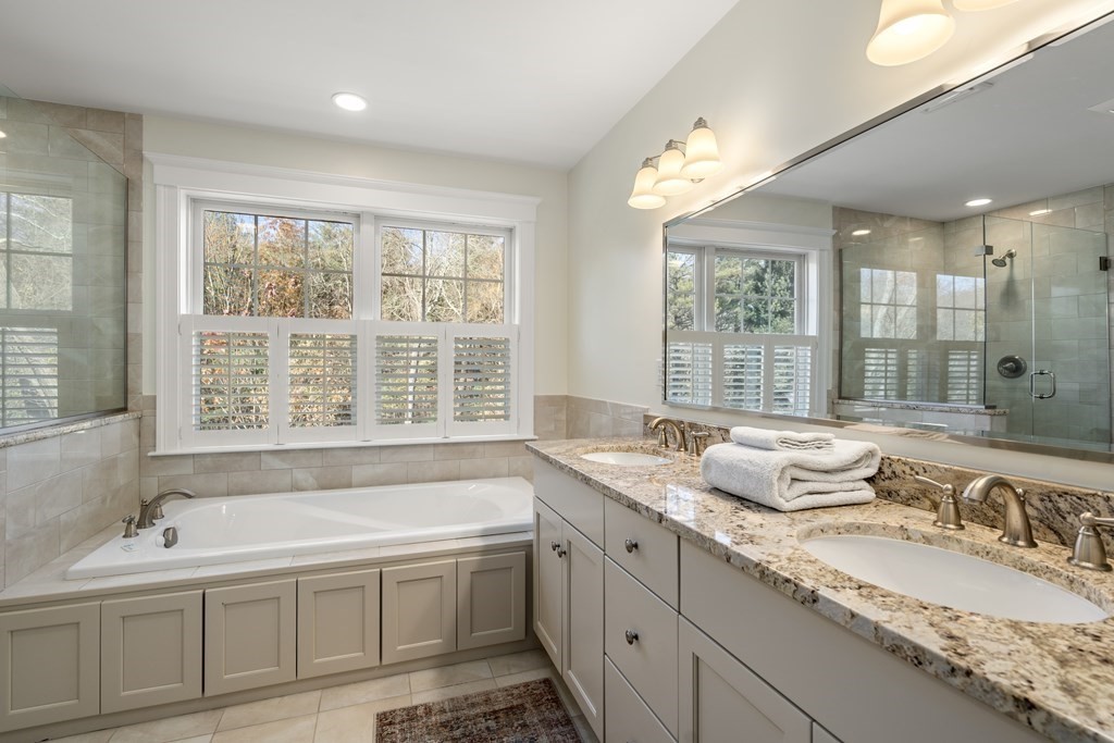33 Centre Street Dover, MA 02030 - Photo 15 of 32 a bath room with a granite countertop sink and large window