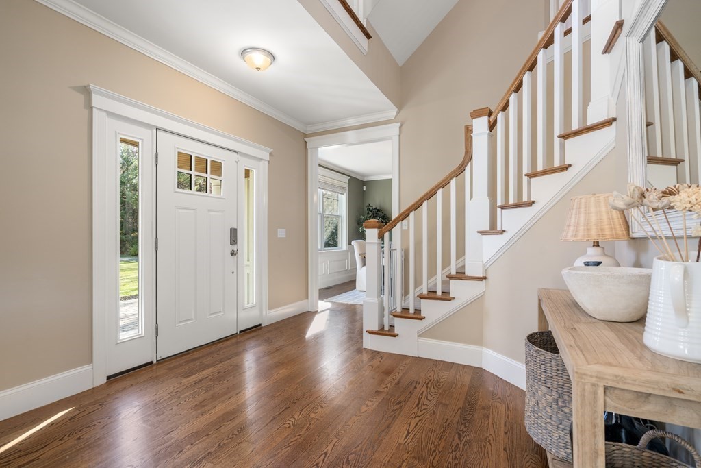 33 Centre Street Dover, MA 02030 - Photo 3 of 32 a view of entryway and hall with wooden floor