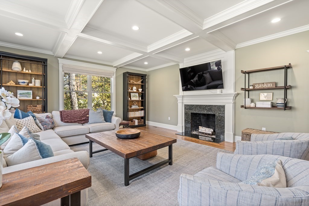 33 Centre Street Dover, MA 02030 - Photo 8 of 32 a living room with furniture a flat screen tv and a fireplace