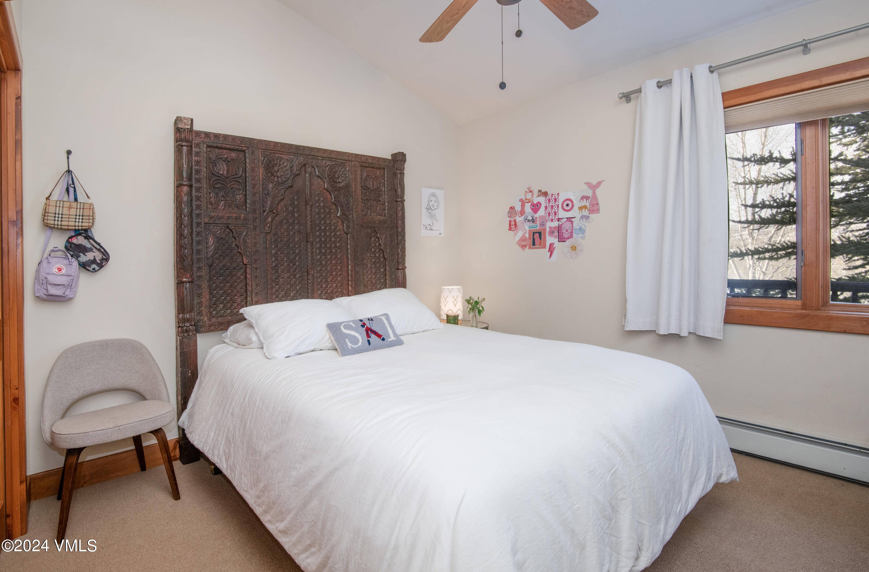111 Knudson Ranch Road Edwards, CO 81632 - Photo 14 of 31 a bedroom with a bed and a chair