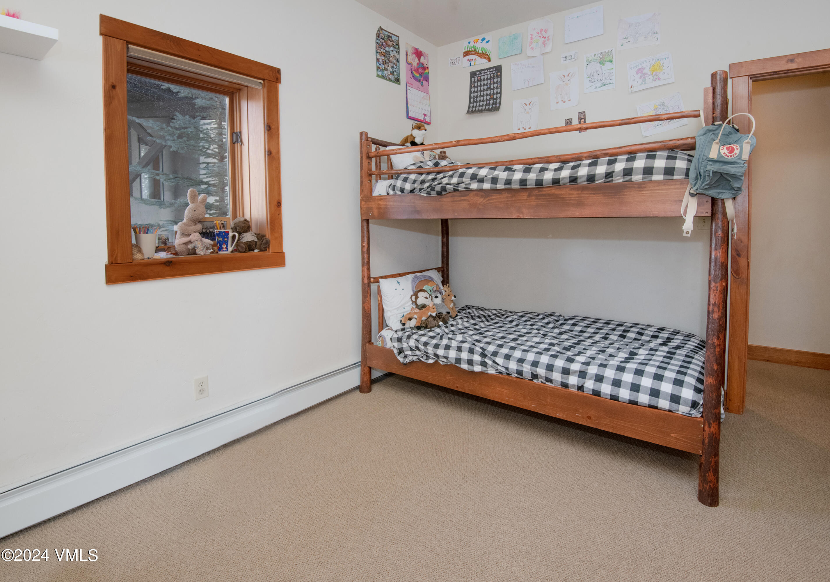 111 Knudson Ranch Road Edwards, CO 81632 - Photo 21 of 31 a bedroom with a bed and window