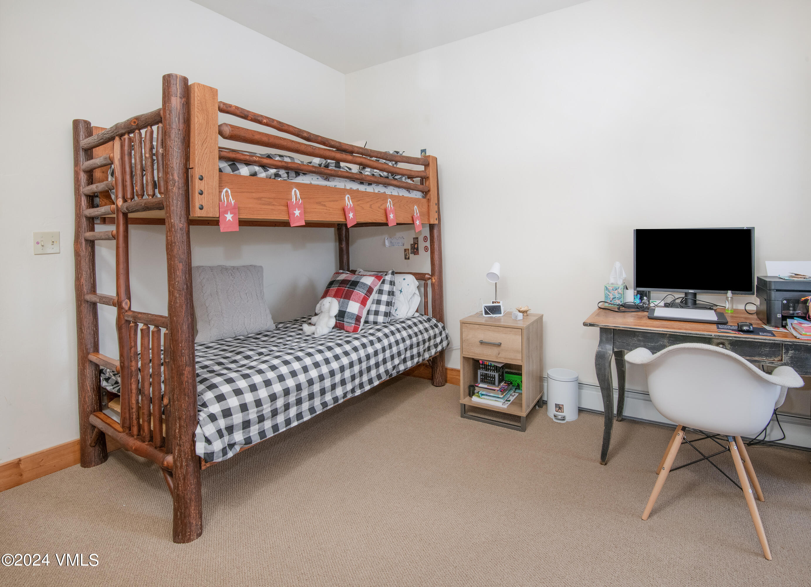 111 Knudson Ranch Road Edwards, CO 81632 - Photo 26 of 31 a bedroom with a bed and a tv in it