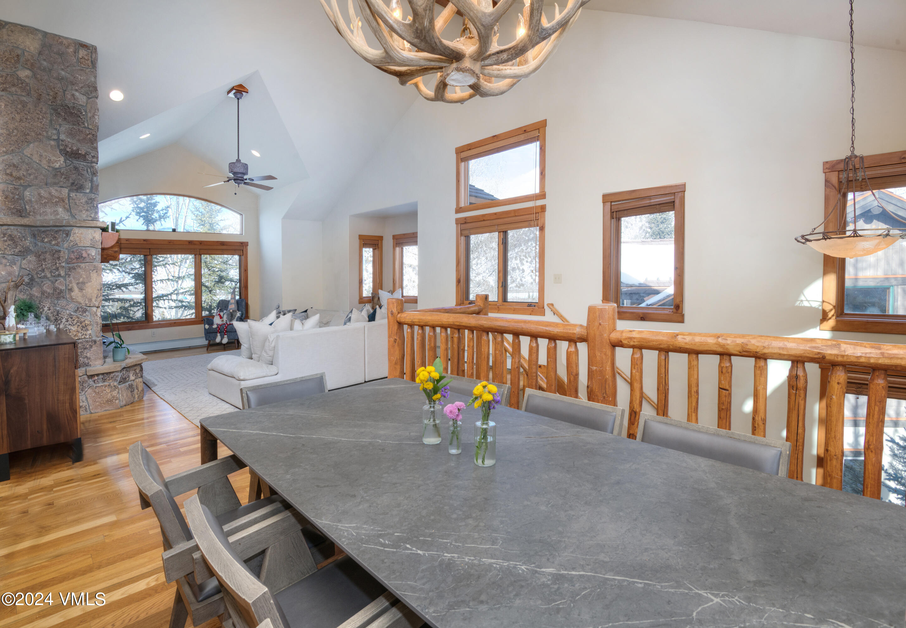 111 Knudson Ranch Road Edwards, CO 81632 - Photo 5 of 31 a view of a dining room with furniture a chandelier and wooden floor