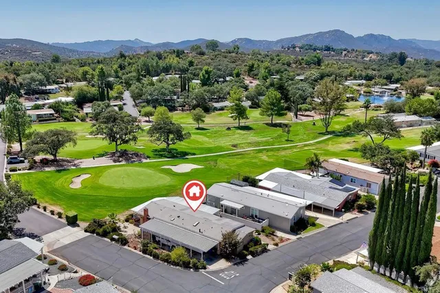 an aerial view of a house with a garden