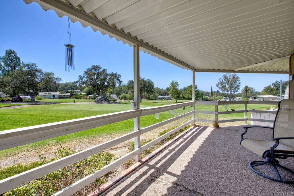 18218 Paradise Mountain Road, Unit 115 Valley Center, CA 92082 - Photo 25 of 27 a view of a garden with wooden fence