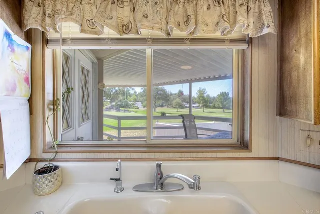 a bathroom with a sink and a large mirror
