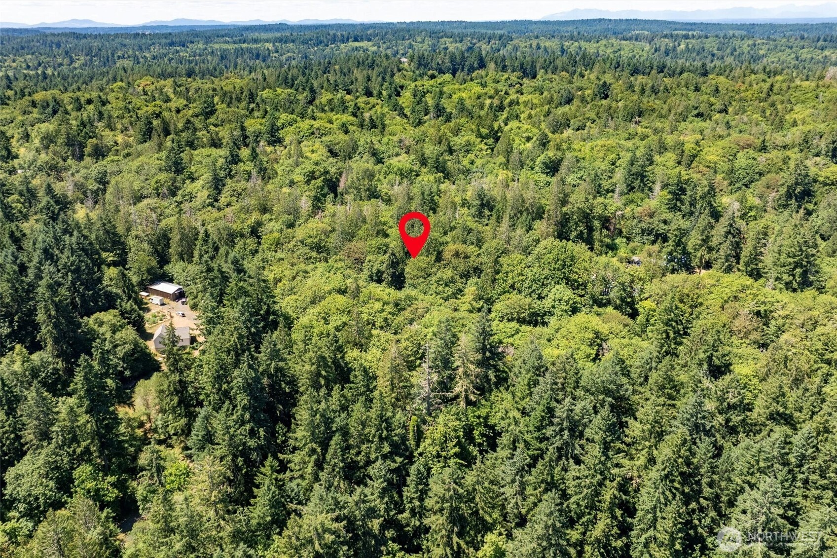 14802 Delano Road Southwest Lakebay, WA 98349 - Photo 11 of 16 an aerial view of a house with a yard