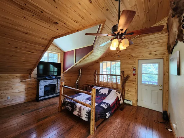 a living room with furniture flat screen tv and a fireplace