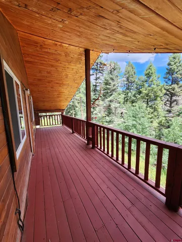 a view of balcony with wooden floor