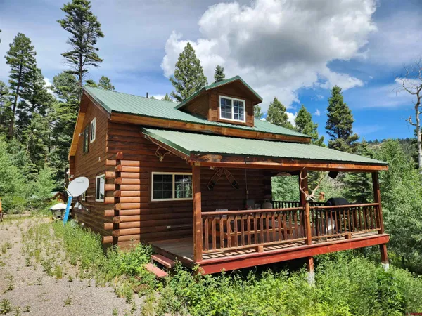 a view of a wooden deck with a yard