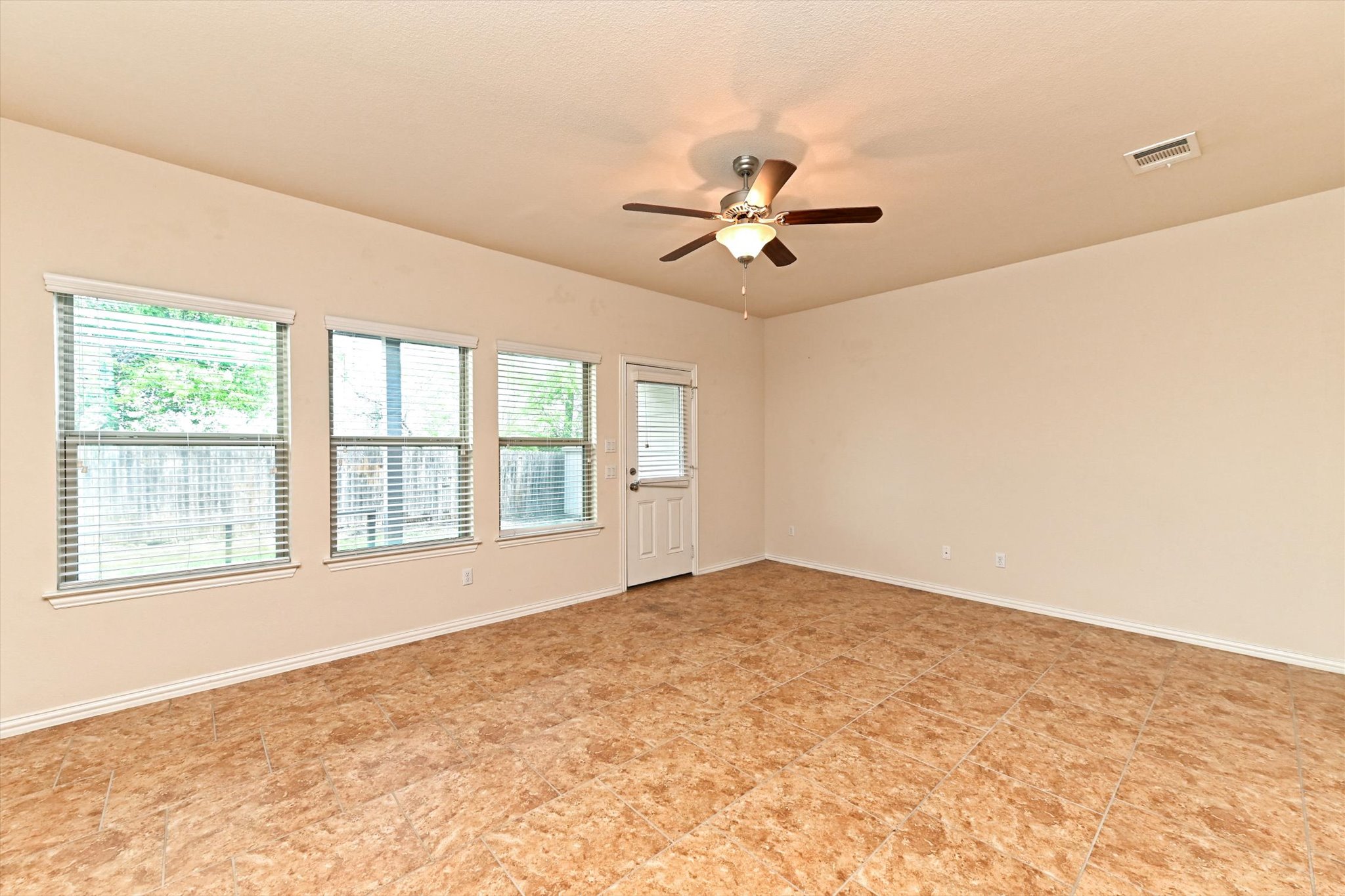 265 Shale Circle Buda, TX 78610 - Photo 11 of 29 Empty room with ceiling fan and baseboards