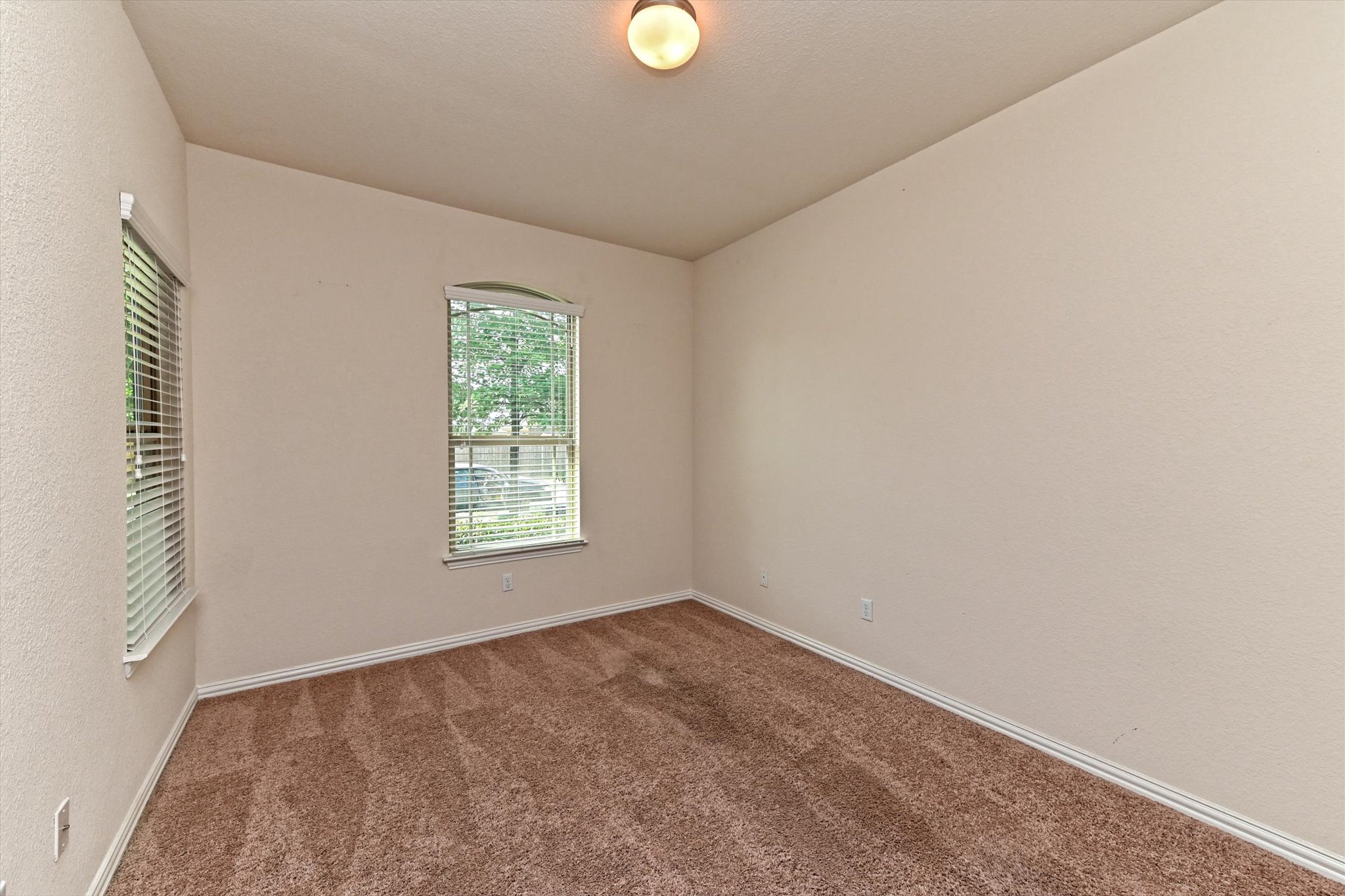 265 Shale Circle Buda, TX 78610 - Photo 14 of 29 Carpeted spare room featuring a textured wall