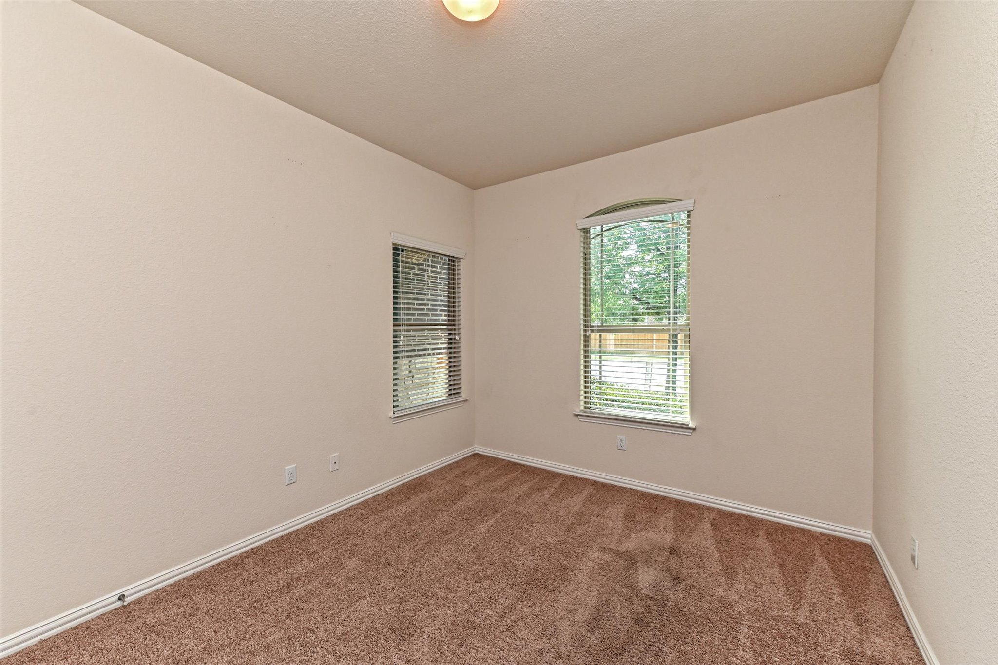 265 Shale Circle Buda, TX 78610 - Photo 15 of 29 Carpeted empty room featuring baseboards