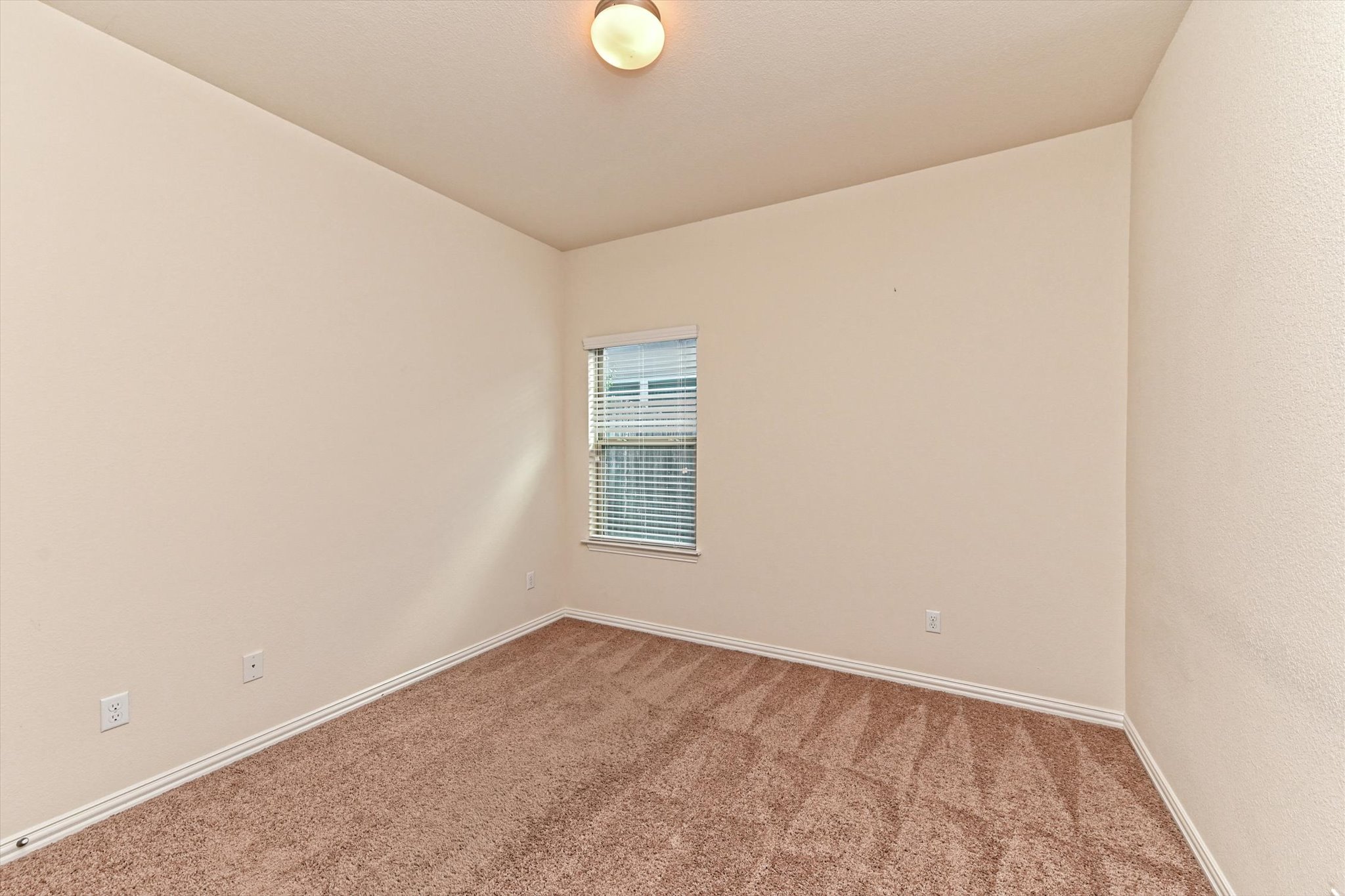 265 Shale Circle Buda, TX 78610 - Photo 24 of 29 Carpeted spare room featuring baseboards