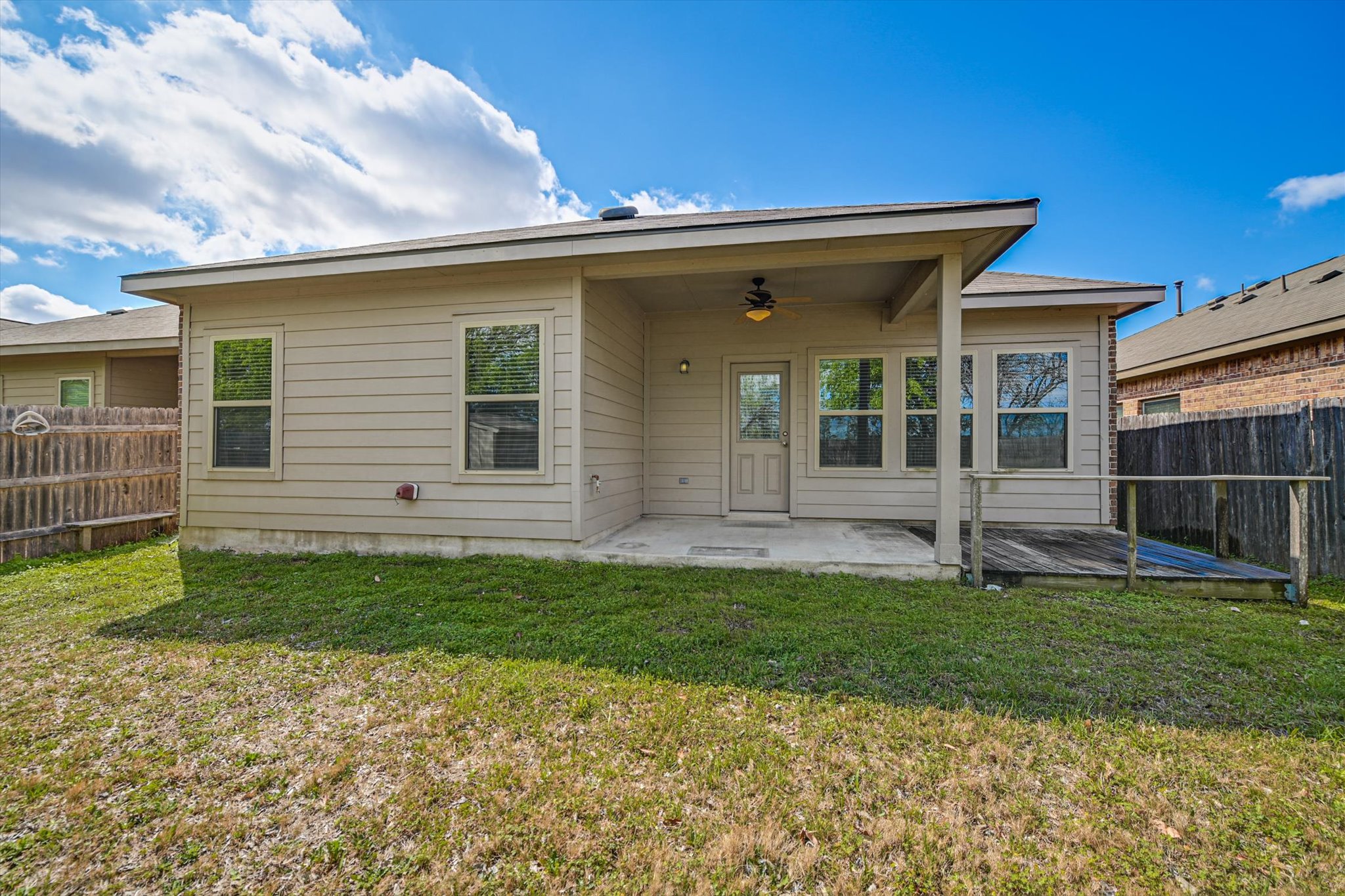 265 Shale Circle Buda, TX 78610 - Photo 28 of 29 Rear view of house featuring a fenced backyard, a patio area, and ceiling fan