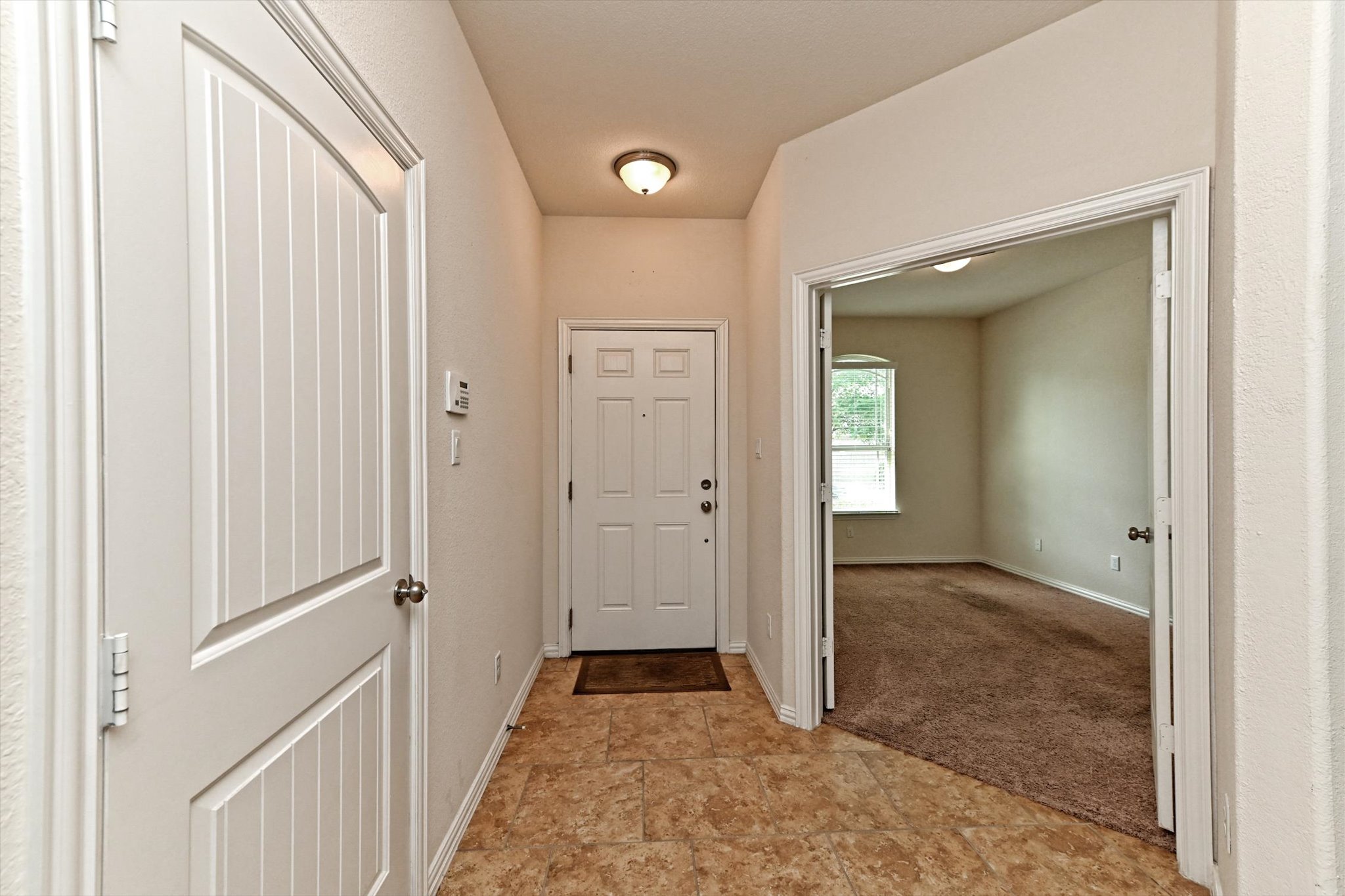 265 Shale Circle Buda, TX 78610 - Photo 4 of 29 Doorway featuring baseboards