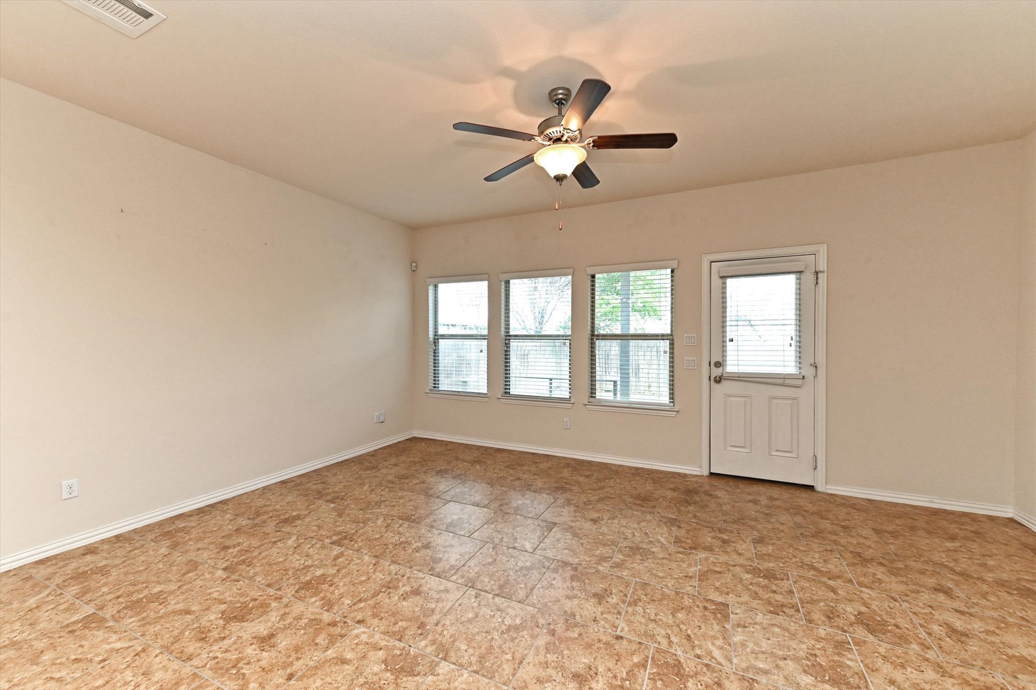 265 Shale Circle Buda, TX 78610 - Photo 10 of 29 Spare room with baseboards and ceiling fan