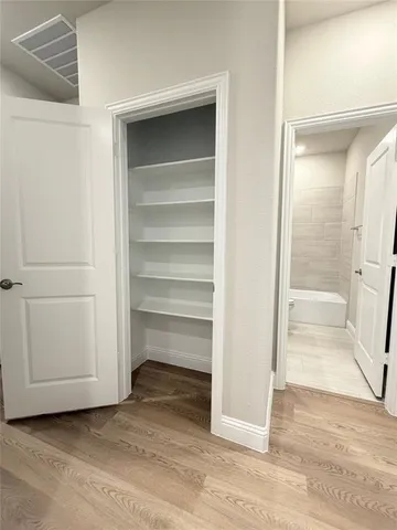 a view of an empty walk in closet