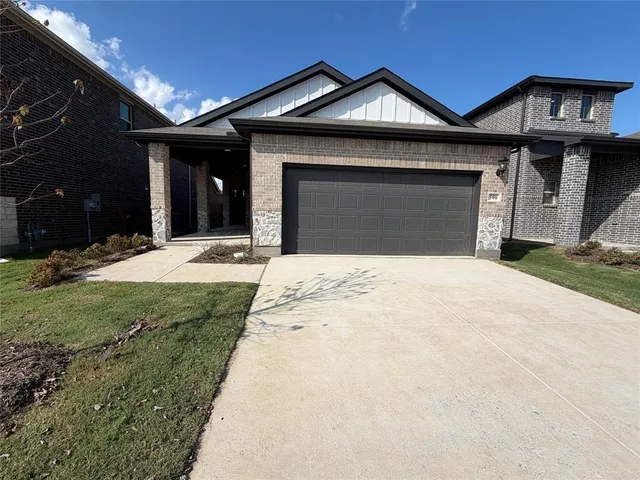 a front view of a house with yard