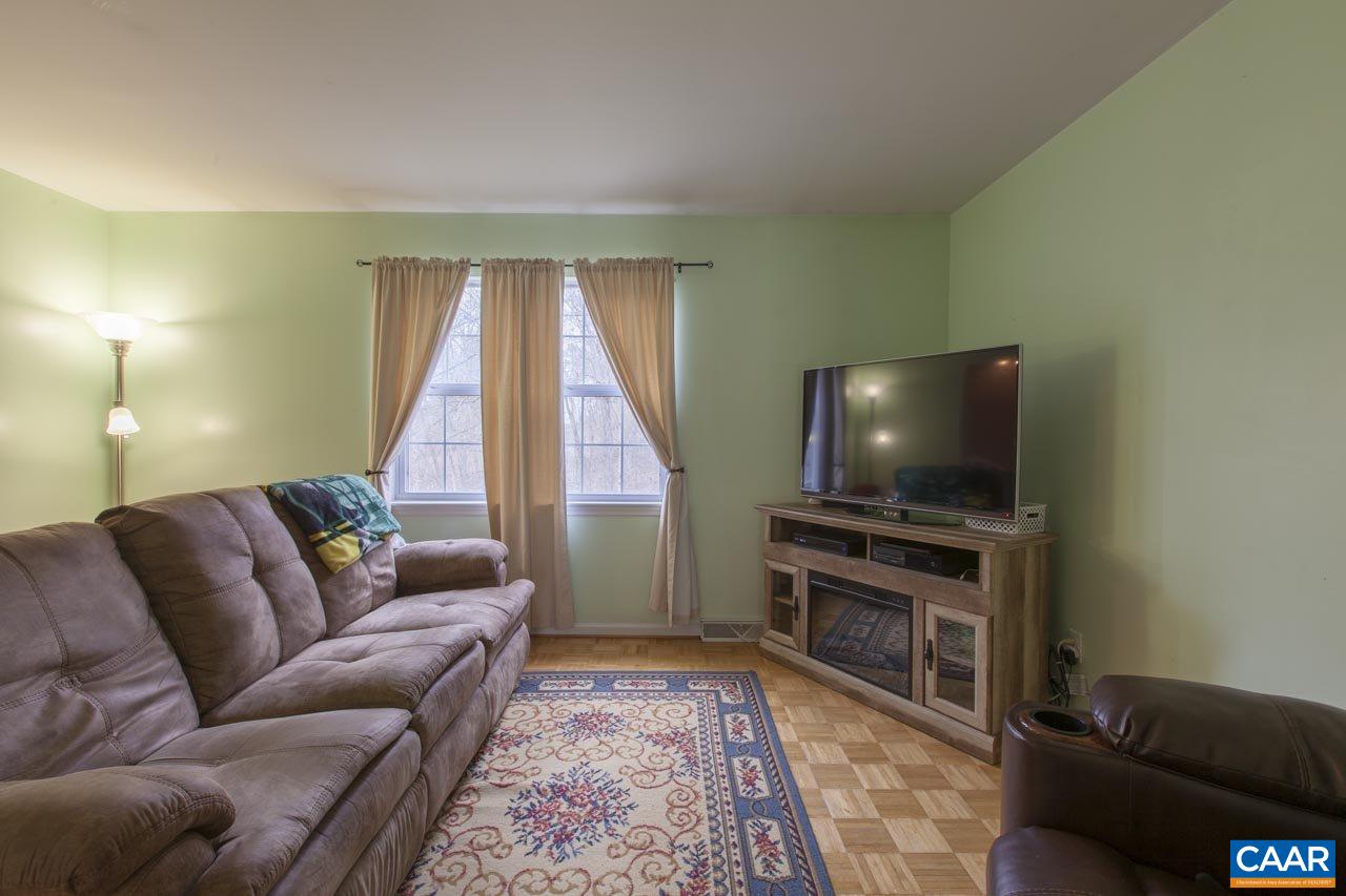 84 Phlox Road Ruckersville, VA 22968 - Photo 8 of 45 a living room with furniture and a flat screen tv