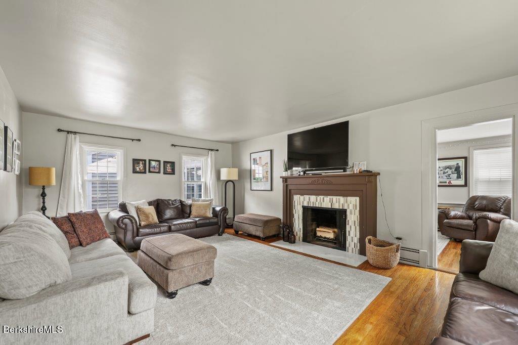 33 Eleanor Road Pittsfield, MA 01201 - Photo 5 of 45 a living room with furniture and a fireplace