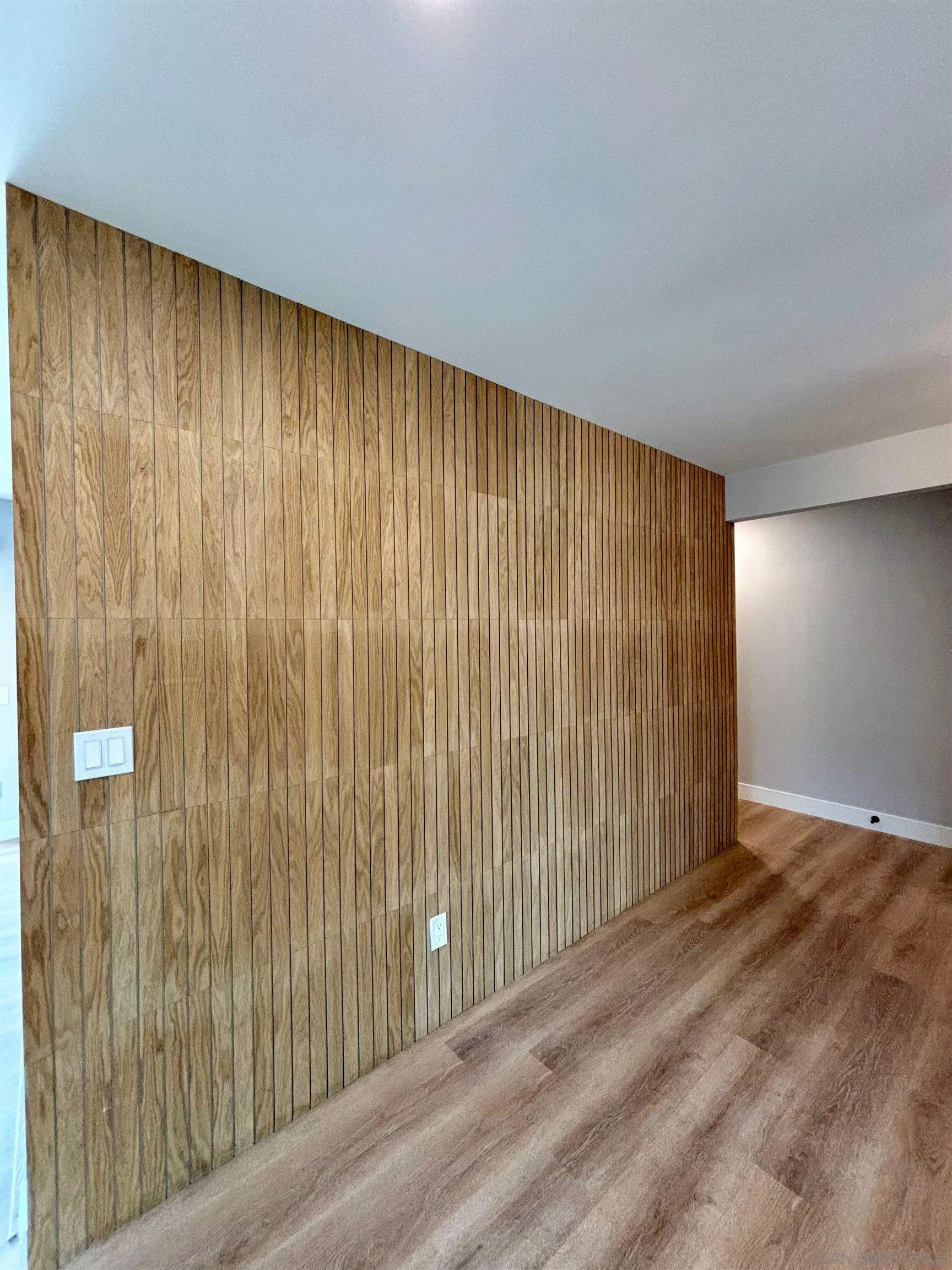 4856 Pacifica Drive San Diego, CA 92109 - Photo 11 of 32 a view of a big room with wooden floor