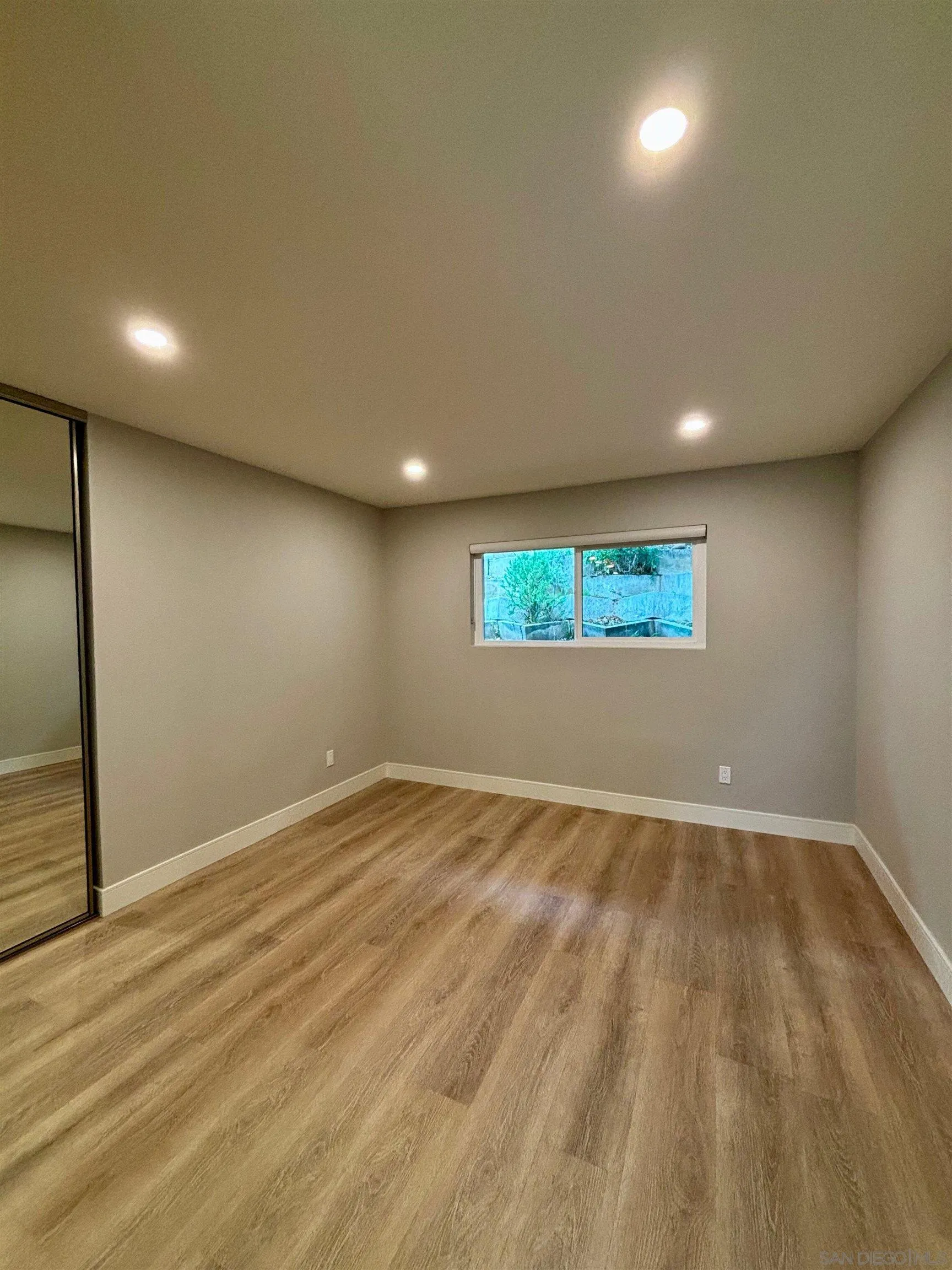 4856 Pacifica Drive San Diego, CA 92109 - Photo 17 of 32 an empty room with a empty space and window