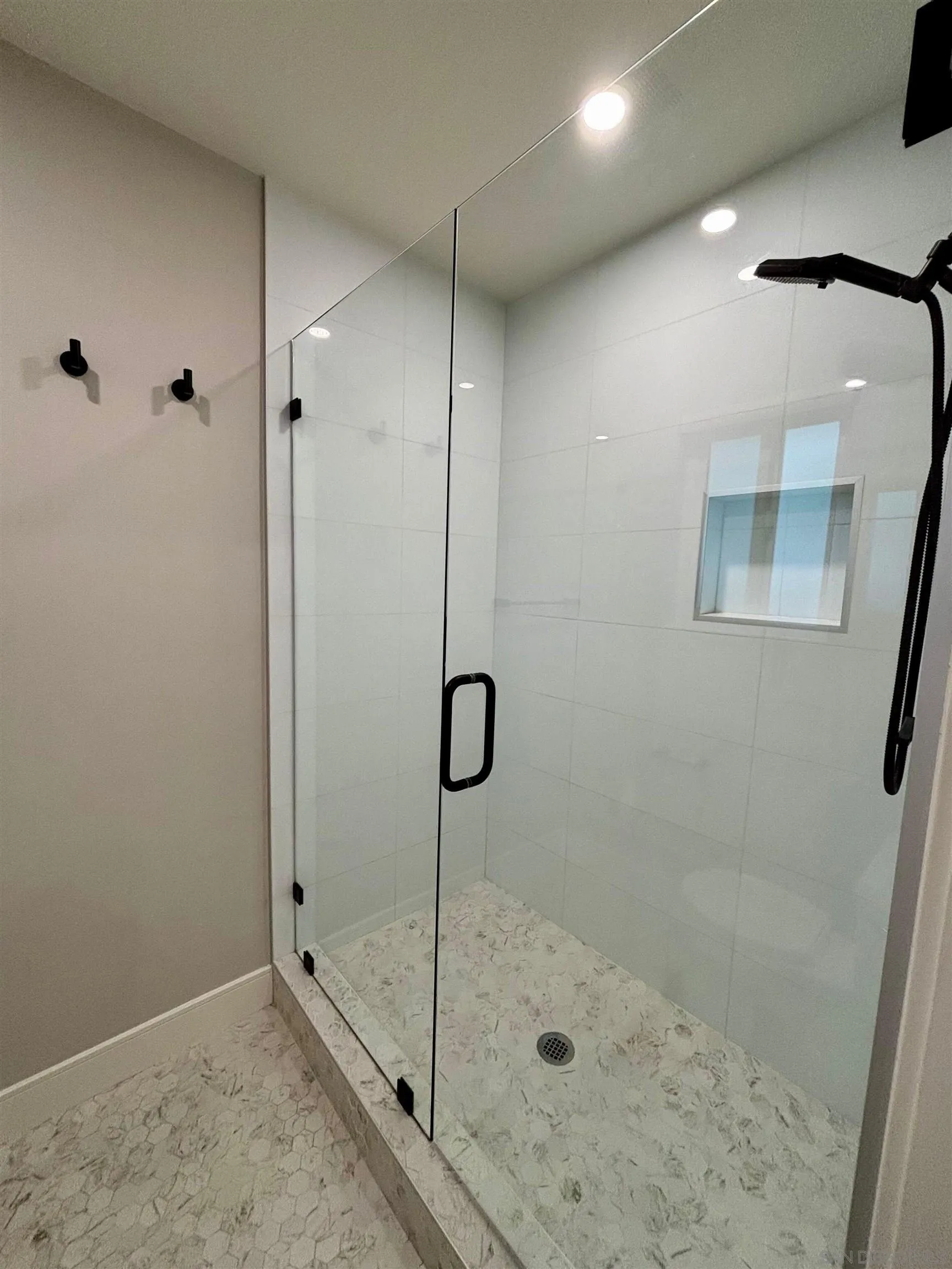 4856 Pacifica Drive San Diego, CA 92109 - Photo 26 of 32 a bathroom with a shower