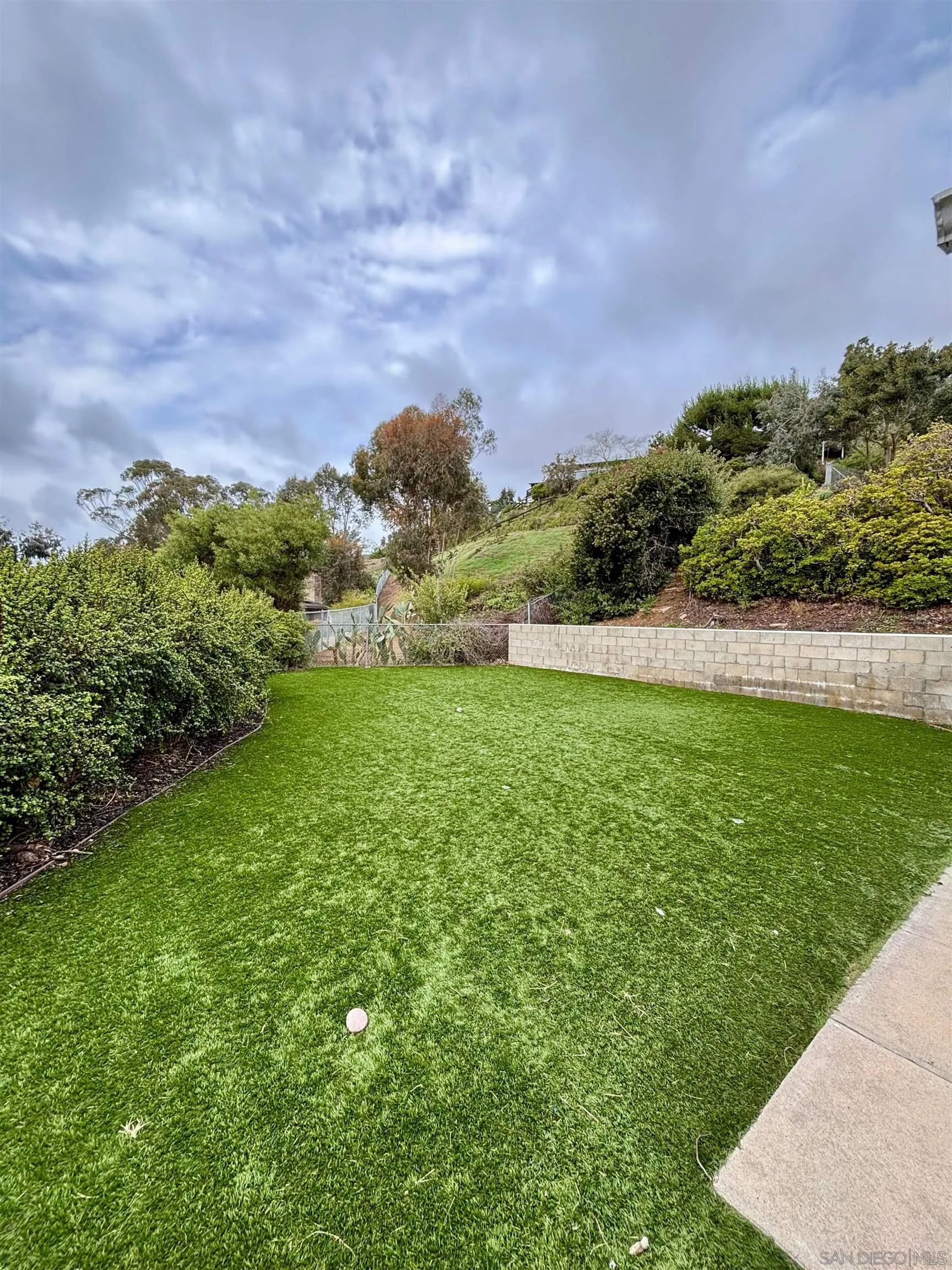 4856 Pacifica Drive San Diego, CA 92109 - Photo 28 of 32 a view of yard with seating area and green space