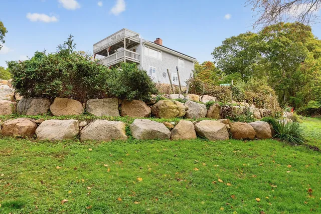 a bedroom with a fireplace and a wooden floor