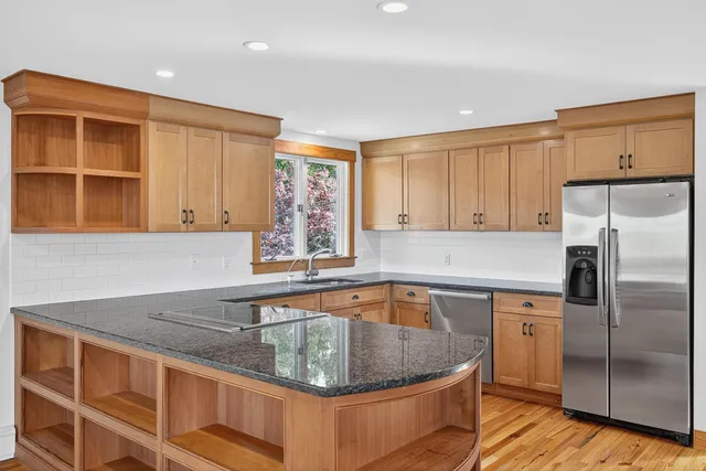 a view of a backyard with table and chairs and potted plants