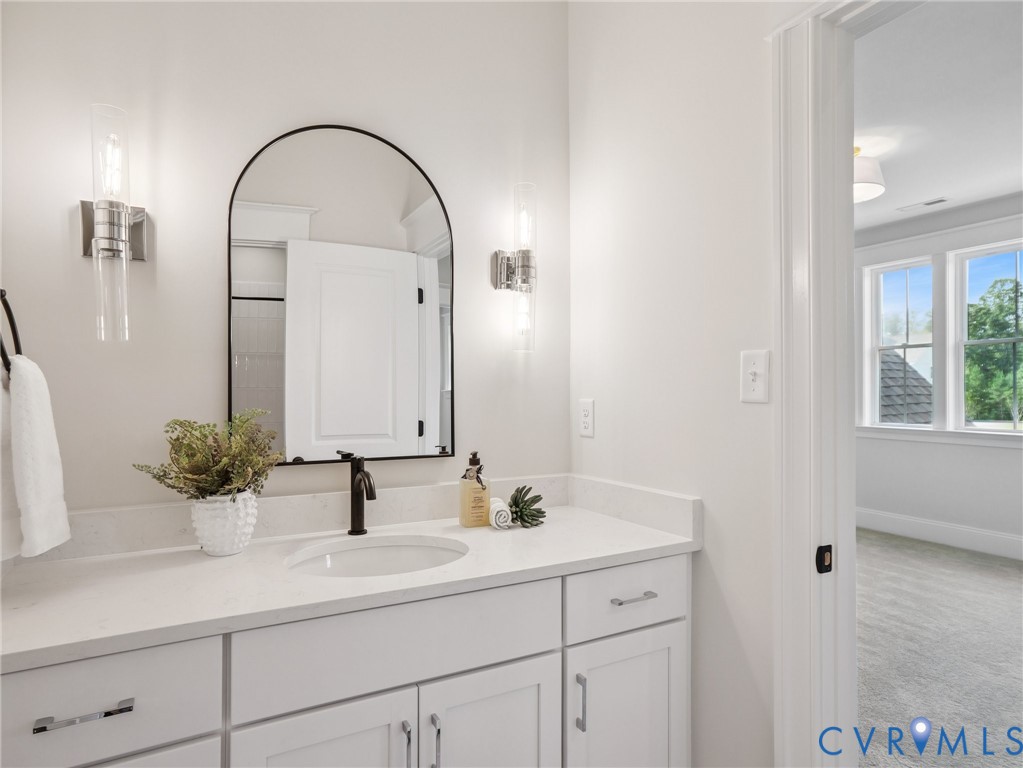 1530 Smokey Rdg Road Maidens, VA 23102 - Photo 38 of 42 a bathroom with a sink and a mirror