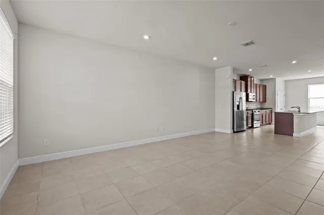 a view of a kitchen with a sink and a window