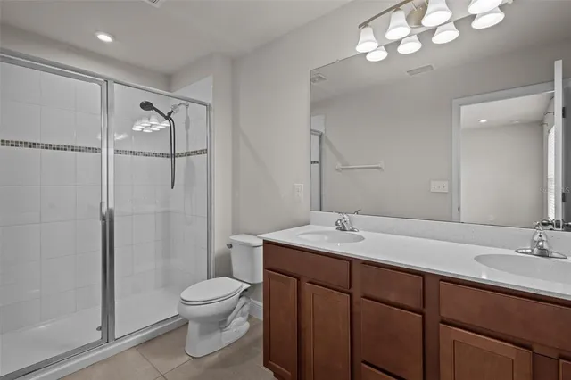 a bathroom with a toilet a sink and a mirror