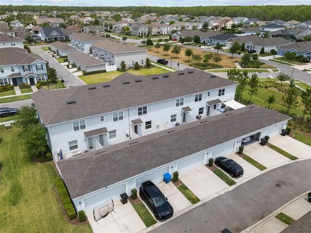 an aerial view of a house with a swimming pool