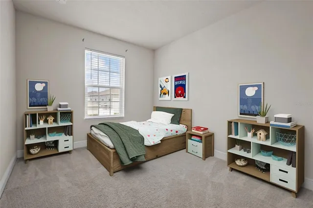 a spacious bedroom with a bed and a book shelf