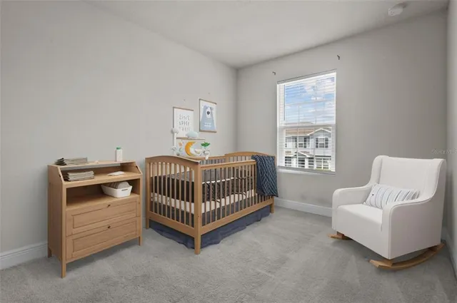 a bedroom with furniture and a window