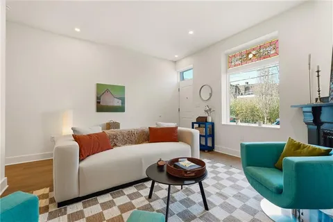 a living room with furniture and a window
