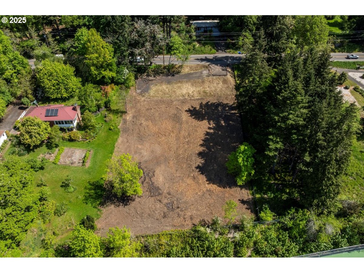 a backyard of a house with a yard and lake view