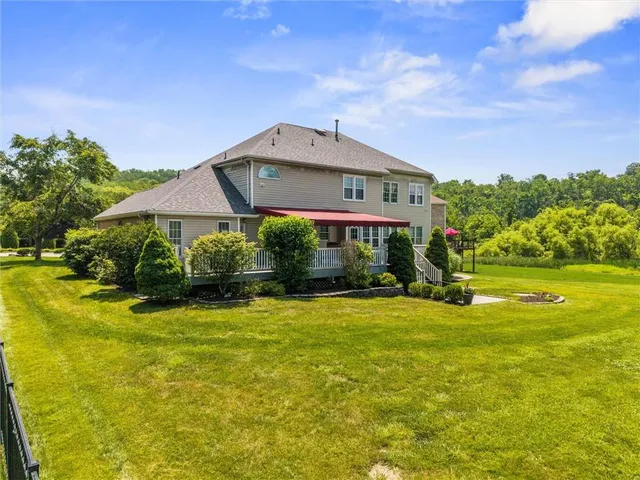 a view of a patio with table and chairs and potted plants