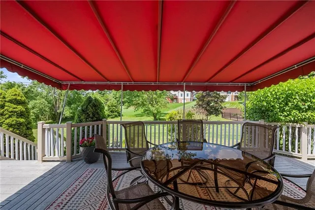an aerial view of a house with a yard and swimming pool