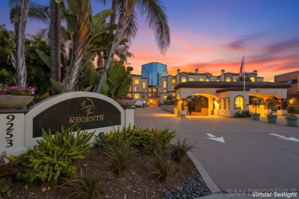 a view of a street with a building in the background