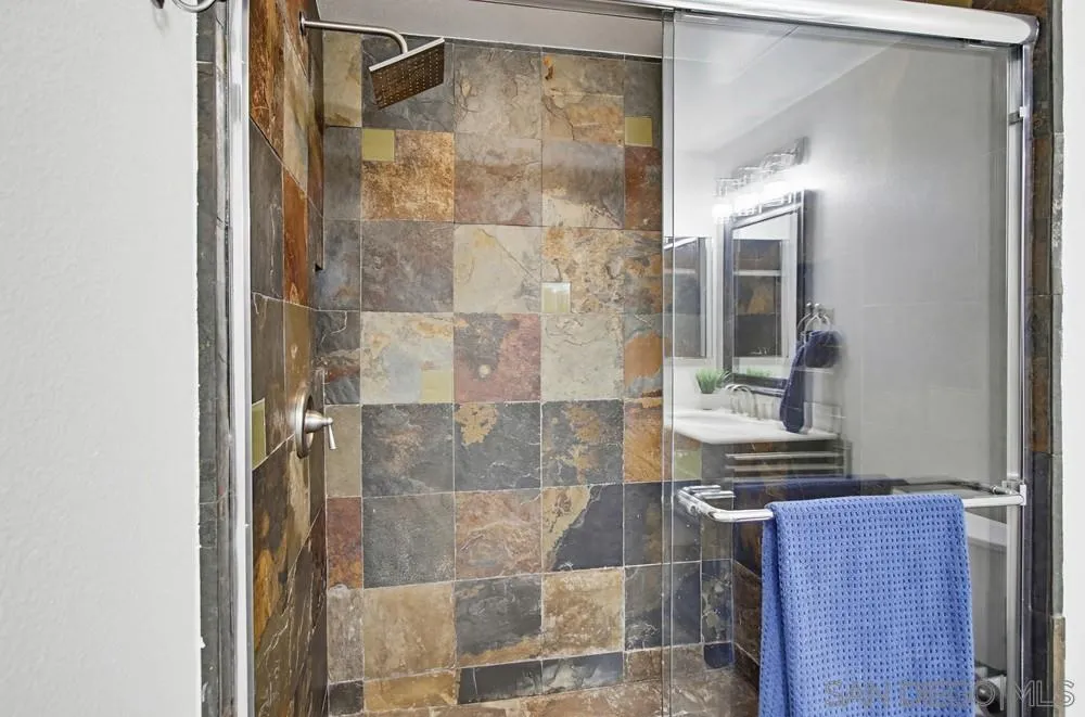 9229 Regents Road, Unit L206 La Jolla, CA 92037 - Photo 18 of 29 a bathroom with a glass shower door