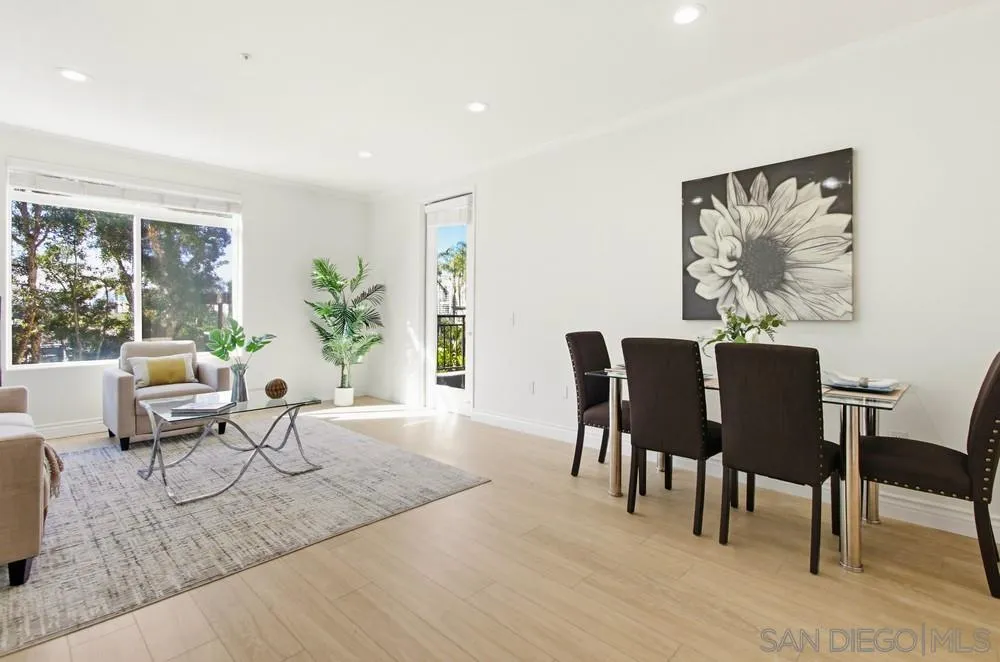 9229 Regents Road, Unit L206 La Jolla, CA 92037 - Photo 4 of 29 a living room with furniture and a potted plant