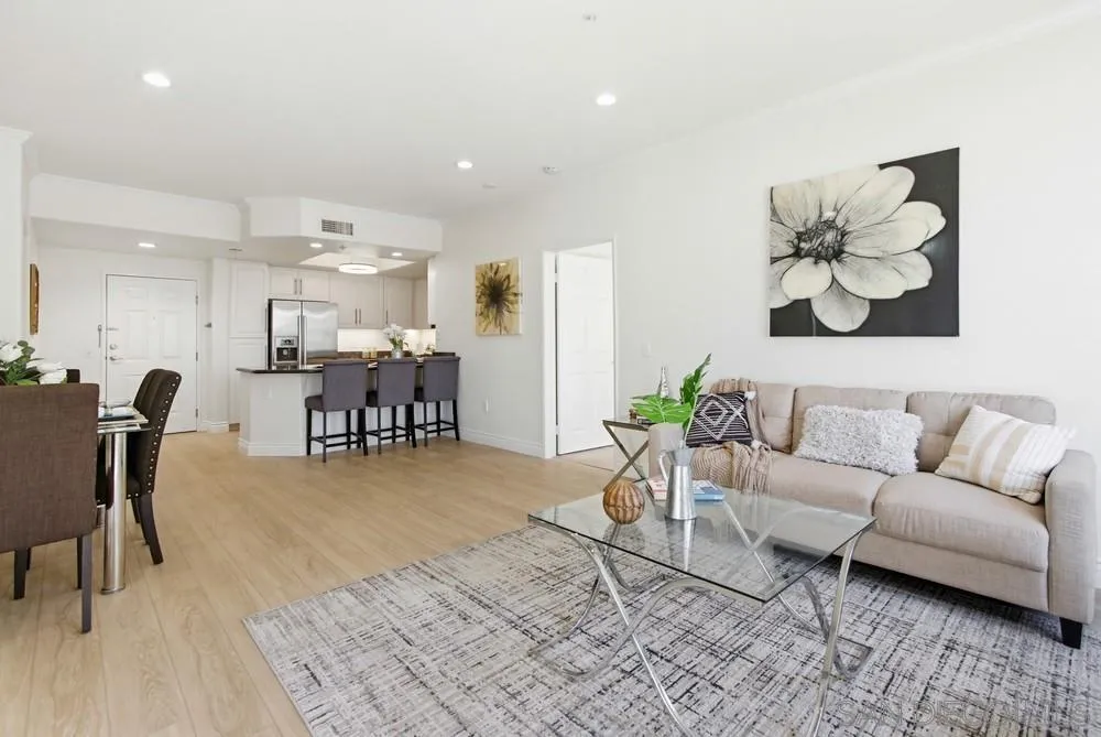 9229 Regents Road, Unit L206 La Jolla, CA 92037 - Photo 7 of 29 a living room with furniture and kitchen view with wooden floor