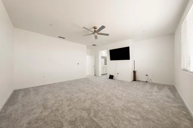 a spacious bathroom with a double vanity sink and a mirror