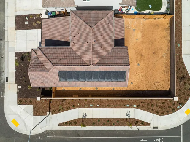 an aerial view of a residential apartment building with a swimming pool