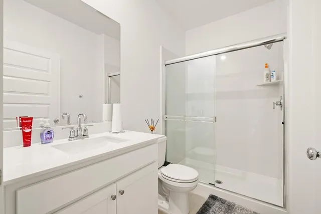 a view of kitchen and hall with wooden floor