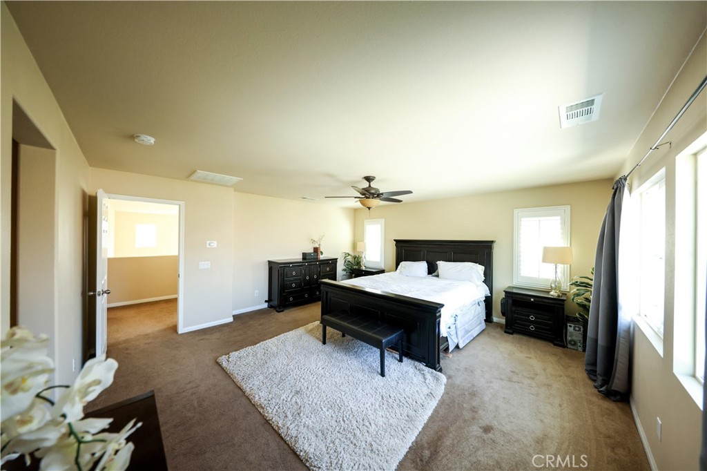 3848 Vine Maple Road San Bernardino, CA 92407 - Photo 11 of 25 a living room with furniture and a chandelier